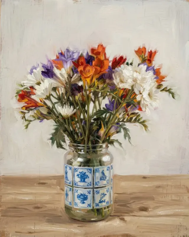 Oil painting of colourful flowers in a glass jar with blue-and-white decorations on a wooden table
